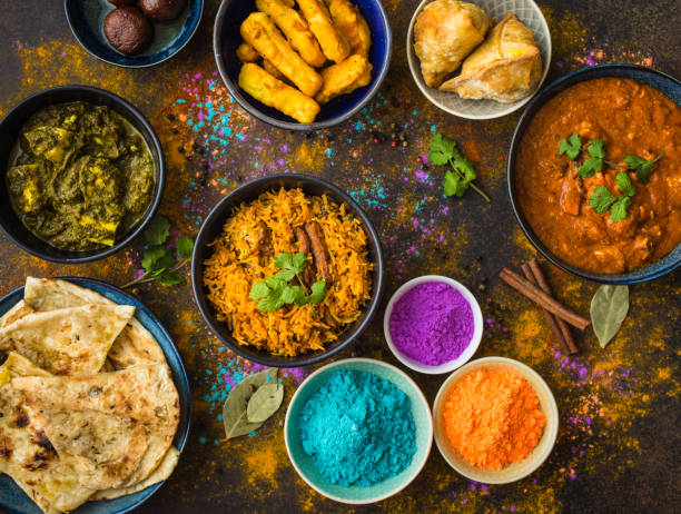 Indian Holi food Traditional Indian food, Holi colours powder, rustic background. Indian Holi holiday. Indian dishes and snacks set. Holi celebration. Top view. Festive Indian table setting. Party food selection sri lankan culture photos stock pictures, royalty-free photos & images