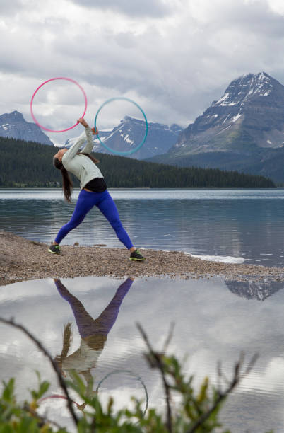 istock Native American woman dances with hoops, in mountains 945527416