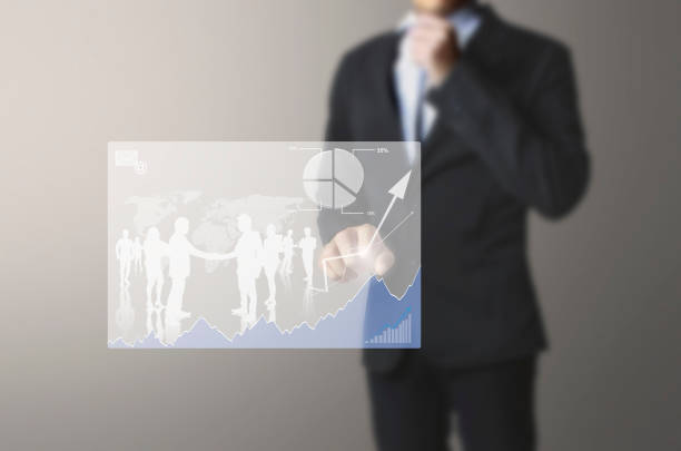 istock businessman with financial symbols coming 945536134