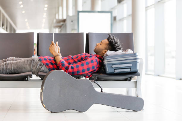 African man waiting at airport lounge