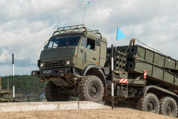 Motion of the mechanized bridge from TMM set Tyumen, Russia - August 6, 2017: International Army Games. Safe Route contest. Motion of the mechanized bridge from TMM set ford crossing stock pictures, royalty-free photos & images