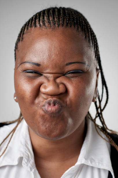 istock Studio portrait of African woman making a silly expression 945563168