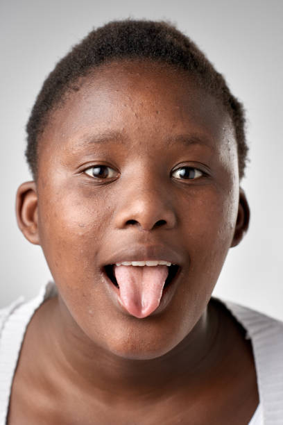 istock Studio portrait of young African girl making a silly expression 945563682