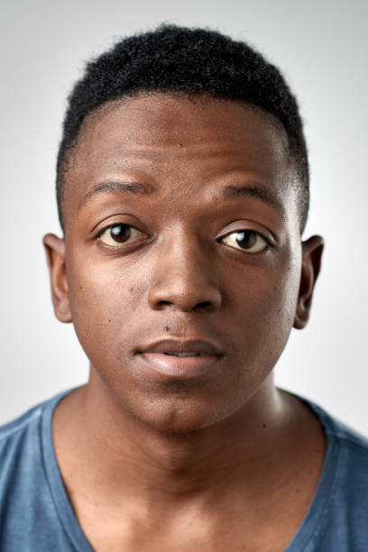 Studio portrait of African man ID passport no expression