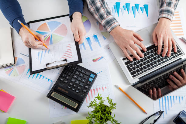 istock Stock market chart and finger pointing 945564656
