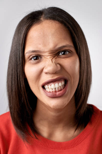 istock Studio portrait of mixed race woman making funny face expression 945564946