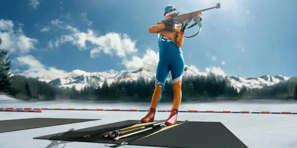 Athletic woman at the biathlon competitions preparing to make a shot. Blue sky and snowy mountains in background. Female Biathlete has a gun and skis.