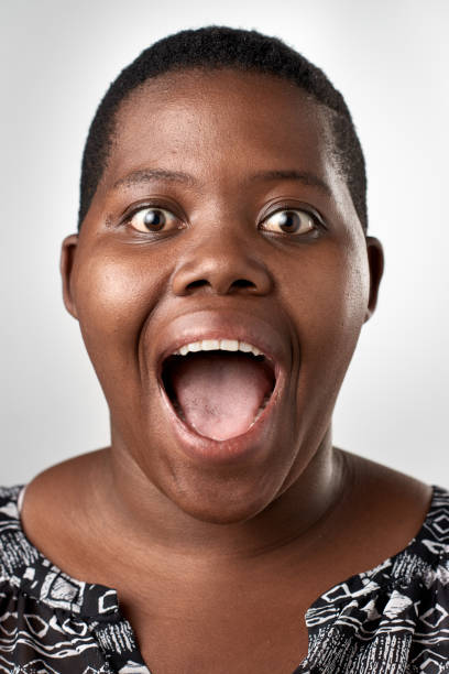 istock Studio portrait of african woman making funny face expression 945574004