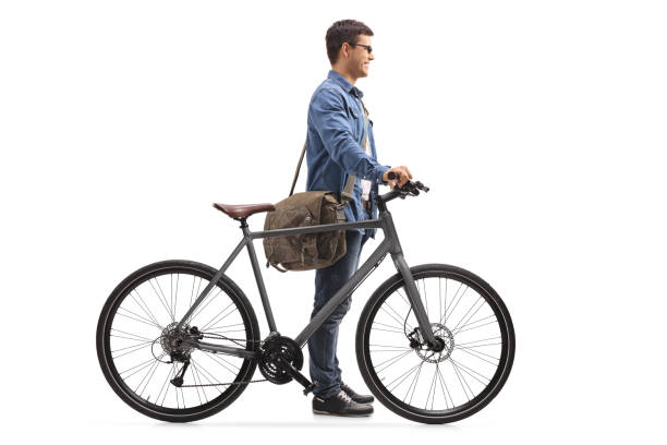 istock Young man with a bicycle waiting in line 945577492