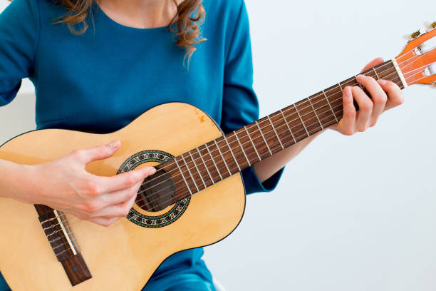 istock Woman playing a guitar 945582188