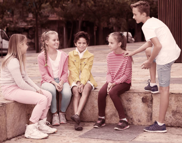 istock Kids talking on city walk 945584292