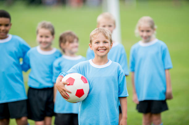 istock Boy With Soccer Ball 945584704