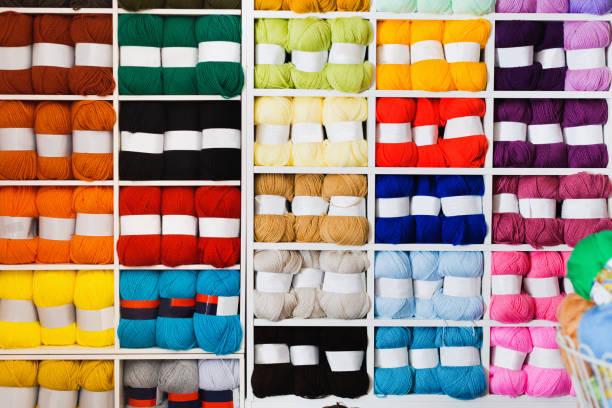 istock Variegated yarns for knitting on shop shelf 945588450