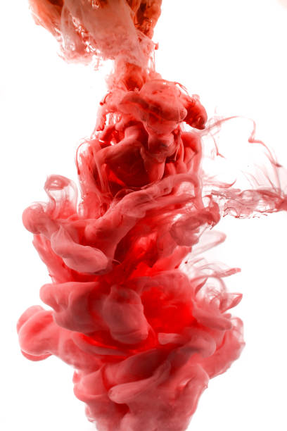 istock red dye in water on white background 945589550