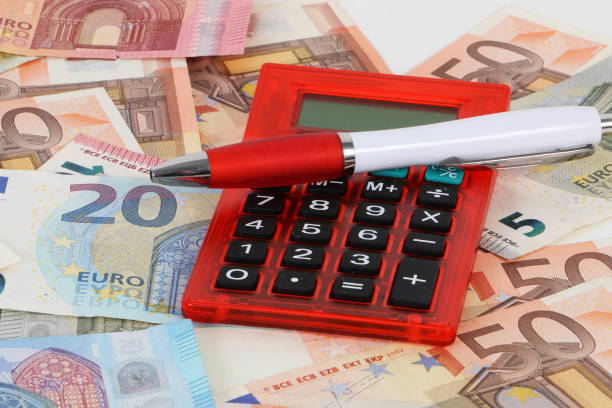 istock euros calculator and a ball pen 945598632
