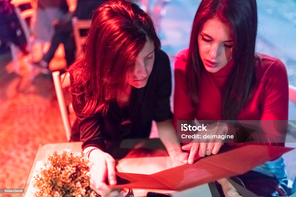 Tonight we dine out Couple of girl at the restaurant 20-24 Years Stock Photo