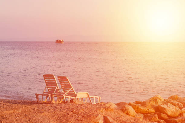 istock sunset on the tropical beach, toned 945604582
