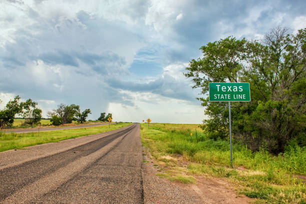 Texas Stateline sign next to historic Route 66 near the town of Texola, Oklahoma Route 66, Texas route 66 sign old road stock pictures, royalty-free photos & images