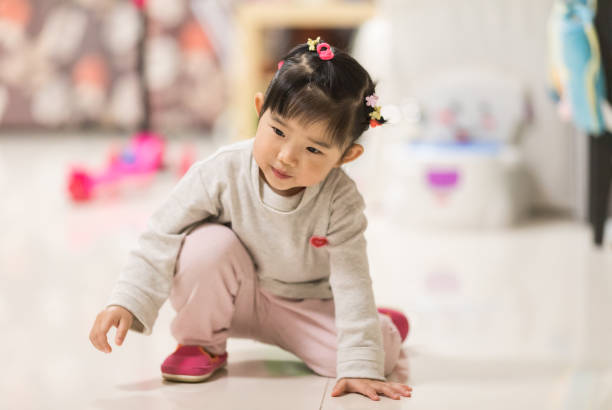 istock Little girl playing at home 945609234