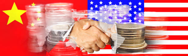 istock China and US flags with a handshake on world map  background 945620808