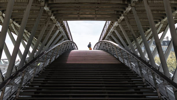 istock The woman on the bridge 945629336