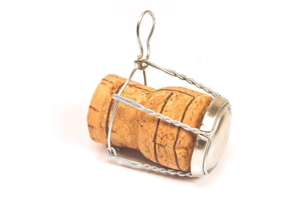 Champagne cork with wire holder isolated on white