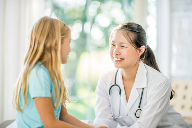 istock Comforting A Girl Before A Checkup 945636098