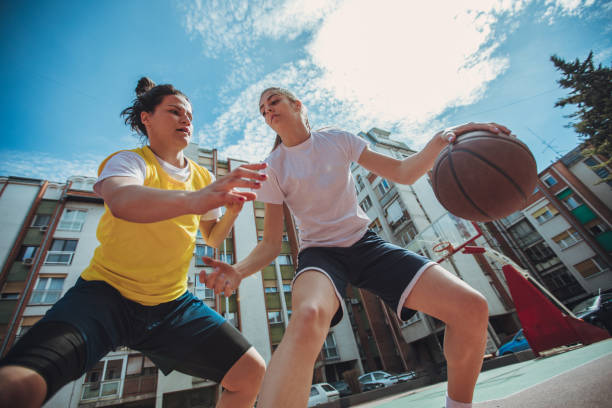 istock Players playing basketball on the playground 945639744