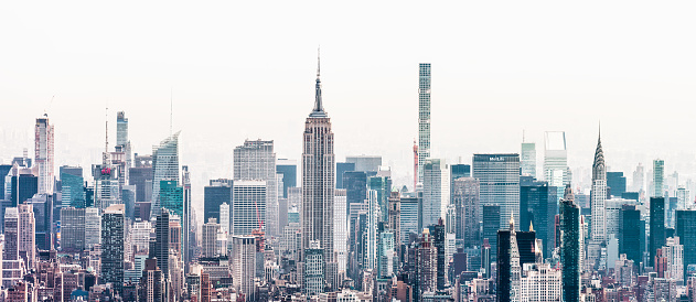 A panoramic view of the towers and buildings of Midtown Manhattan from Lower Manhattan.