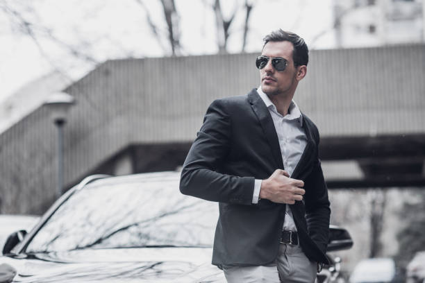 istock Businessman by the business car 945646888