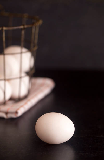 istock Farm Fresh White Chicken Eggs on a Slate Counter 945657104