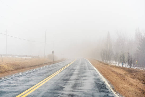 Poor visibility on a wet country road.