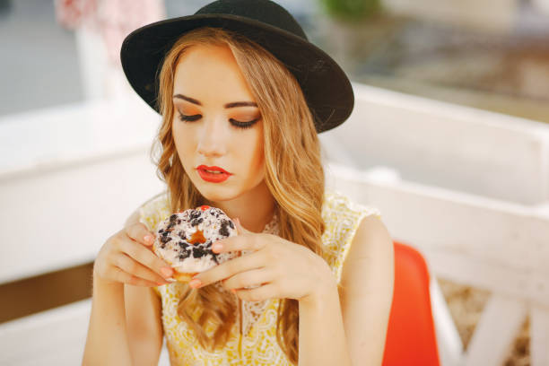 istock girl with donut 945674936