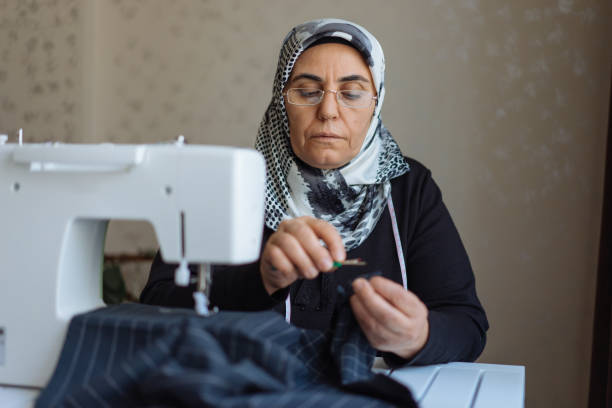 Tailor woman working at the sewing machine