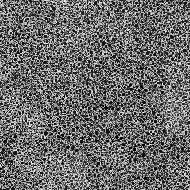 Hand-drawn circles with a soft pencil on white paper - seamless texture of hand-made lace Texture of hand-made lace. Beautiful original background made by pencil. Zoom to see the details. Seamless pattern - duplicate it vertically and horizontally to get unlimited area. Delicate transparency ornament. Square piece of paper with thousands of circles in various size. porous sponge stock pictures, royalty-free photos & images