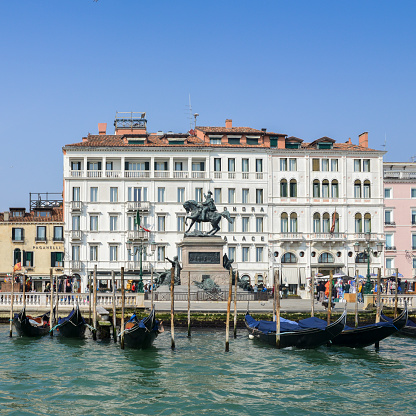 Venice, Italy - March 28th, 2018: Gondolas on the pier in Venice