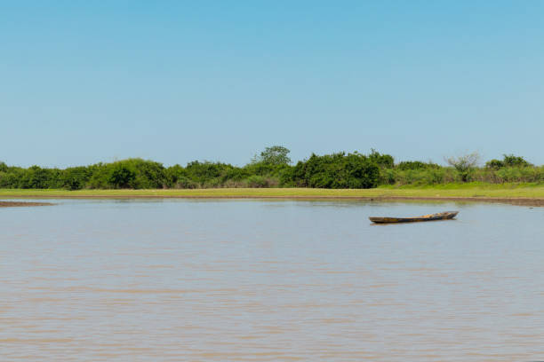 istock Wood boat moored on the river. Water in the drought. 945685580