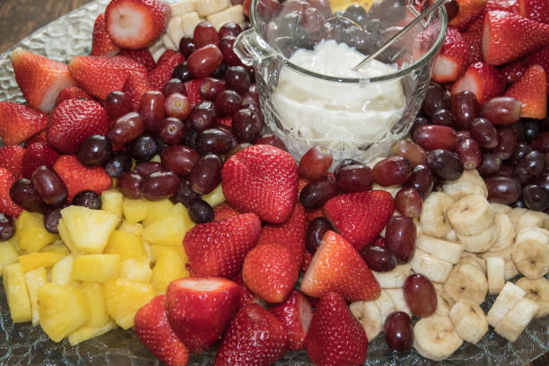 Beautiful Party Fruit Platter A beautiful party fruit platter beckons for tasting delicious fresh fruit. partytime stock pictures, royalty-free photos & images