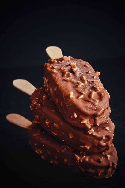 istock Vanilla Ice Cream with Chocolate on a Stick 945694544