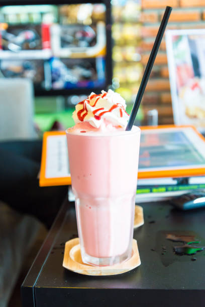 istock Ice Strawberry Smoothie on the wooden table. 945694750