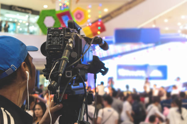 istock The camera man taking photos and recording video on stage. 945694832