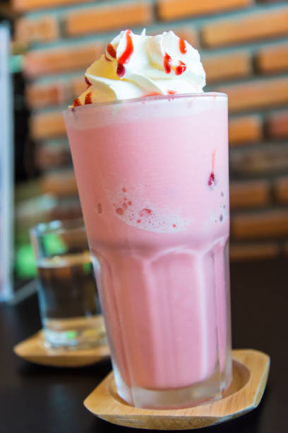 istock Ice Strawberry Smoothie on the wooden table. 945695012