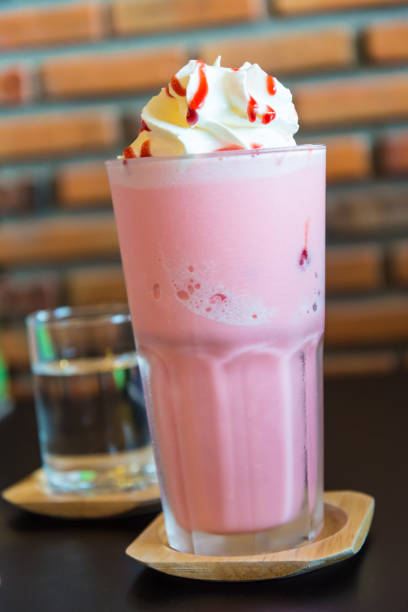 istock Ice Strawberry Smoothie on the wooden table. 945695080