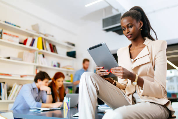 istock Businesswoman holding tablet in office 945695546