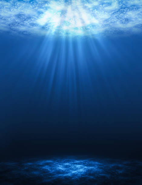 Sunbeam vertical Abstract underwater backgrounds in the sea. stock photo