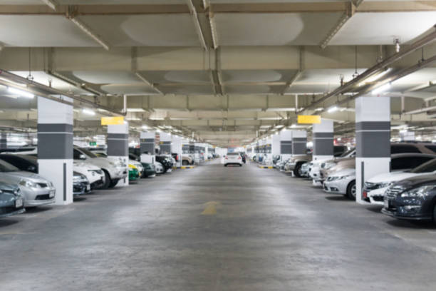 istock Blurred image Parking garage In the mall for background. 945711728