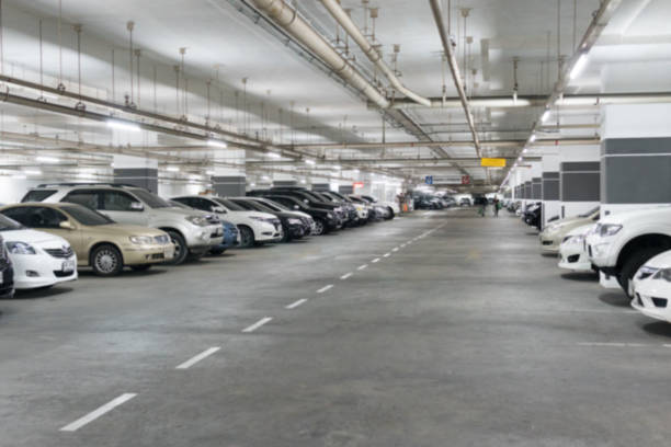 istock Blurred image Parking garage In the mall for background. 945711732