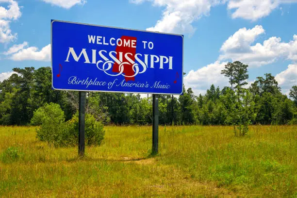 Photo of Welcome to Mississippi sign with text 