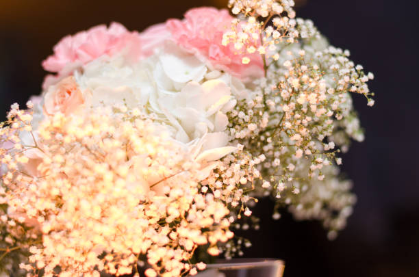 istock flower arrangement at a wedding reception 945724470