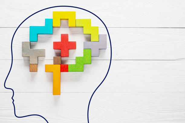 istock Human brain is made of multi-colored wooden blocks. 945728858